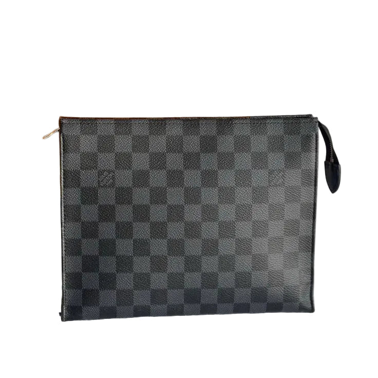 Louis Vuitton pouch with checkered pattern on a gray surface, with an orange Louis Vuitton bag in the background.