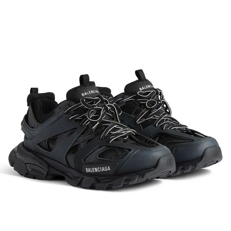 Black Balenciaga sneakers on a white background