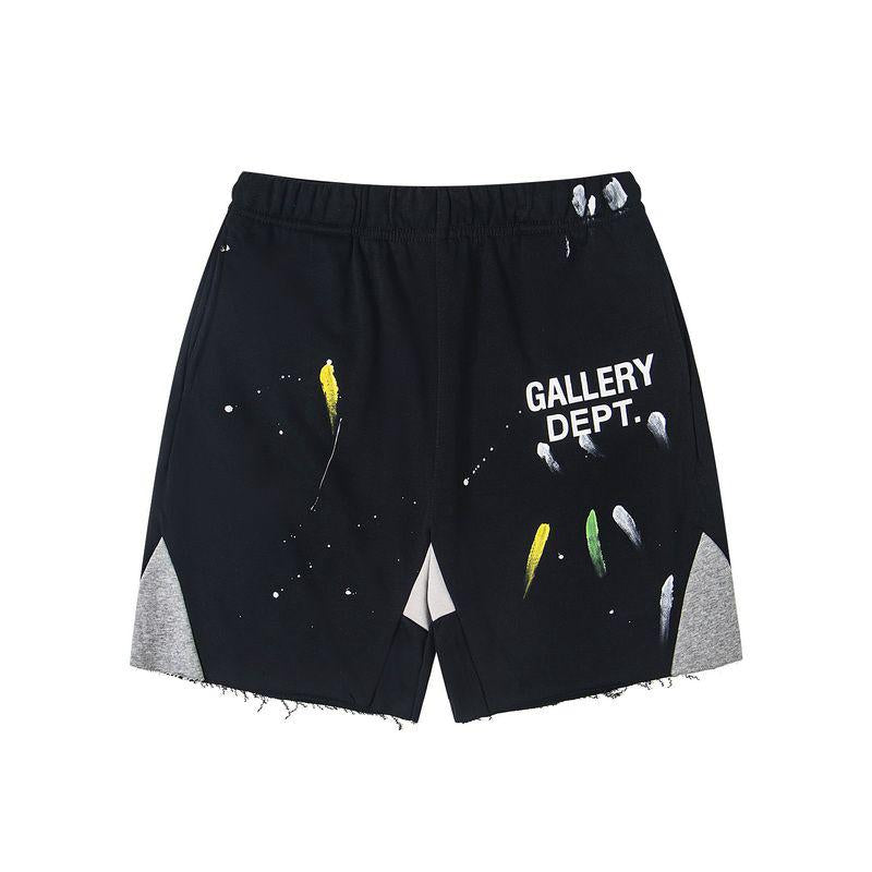 Black shorts with 'GALLERY DEPT.' text and abstract designs on a white background