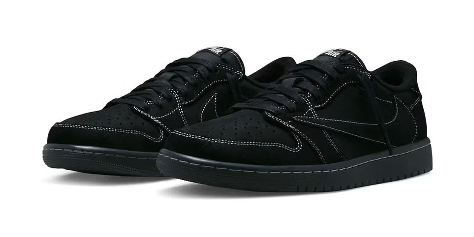 Pair of black sneakers on a white background