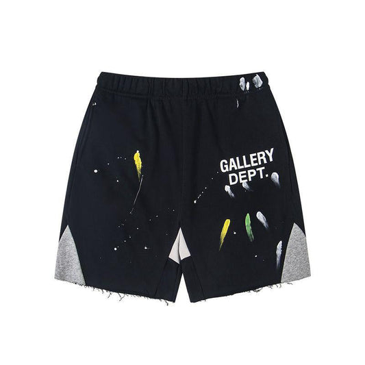 Black shorts with 'GALLERY DEPT.' text and abstract designs on a white background