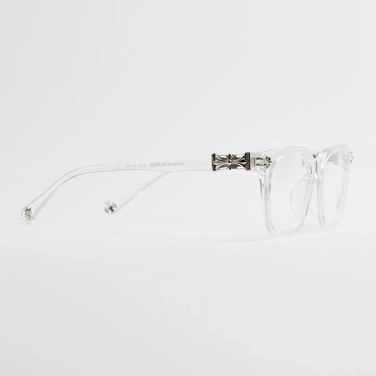 Clear eyeglasses with a decorative temple on a white background