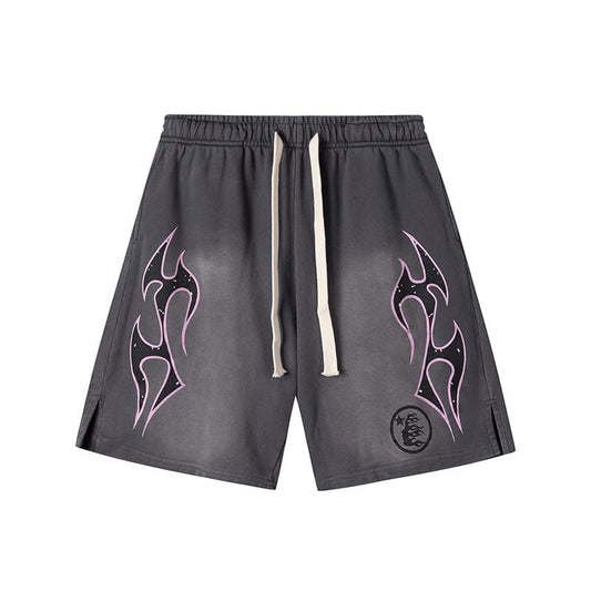 Gray shorts with tribal designs on a white background