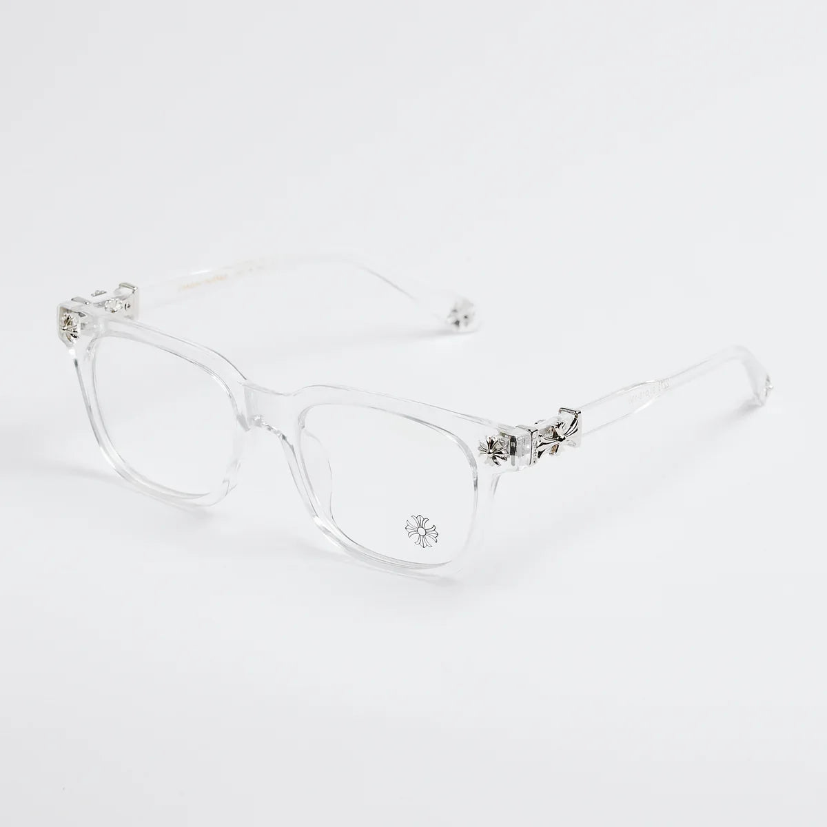 Clear eyeglasses with decorative elements on a white background