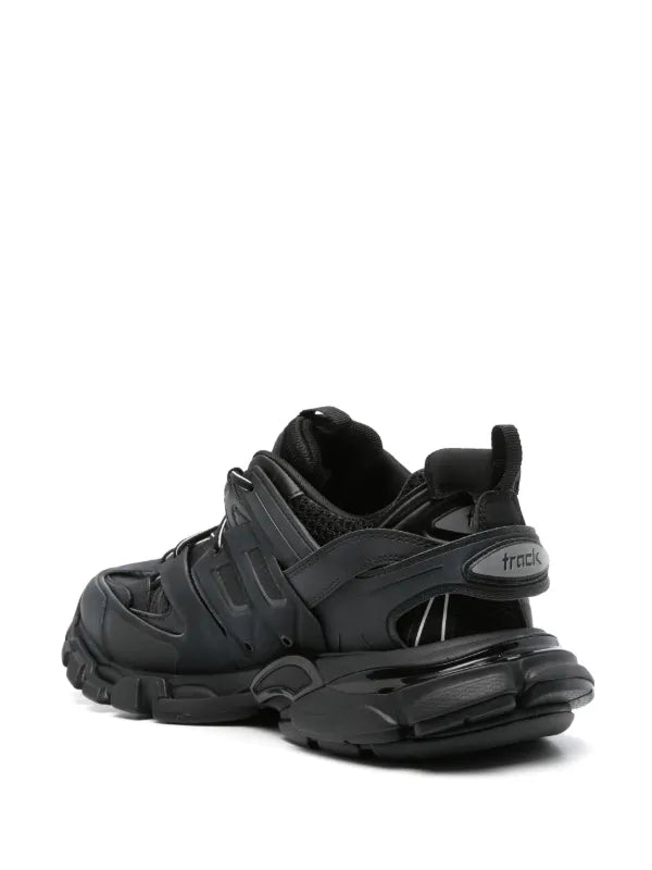 Black sneaker with a transparent sole on a white background