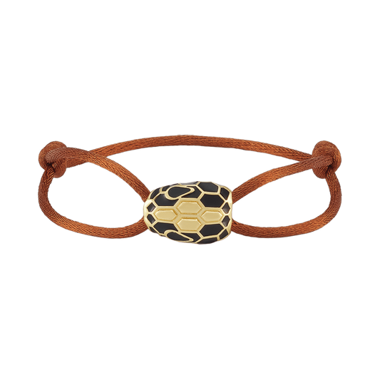Bracelet with a snake-shaped clasp on a green background