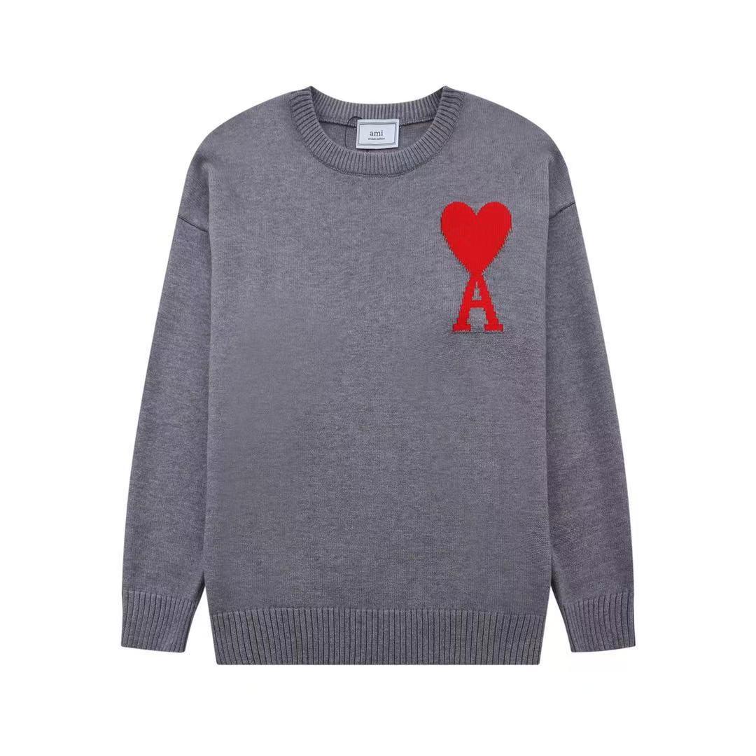 Gray sweater with a red heart and 'A' logo on a white background