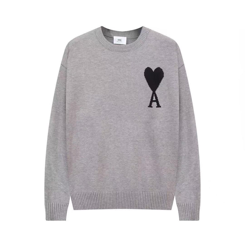 Gray sweater with black heart and letter A design on a white background