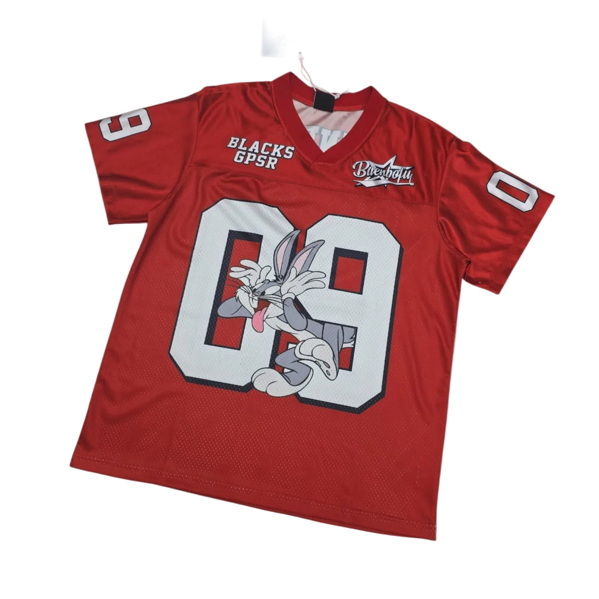 Red sports jersey with cartoon character and visible branding on a white background